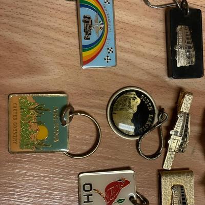 Greyhound bus keychains, money clip, and nameplate