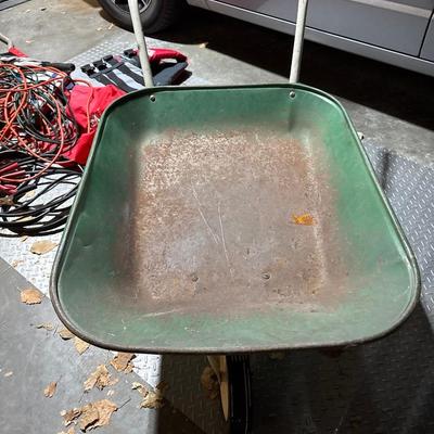 Vintage green wheel barrel