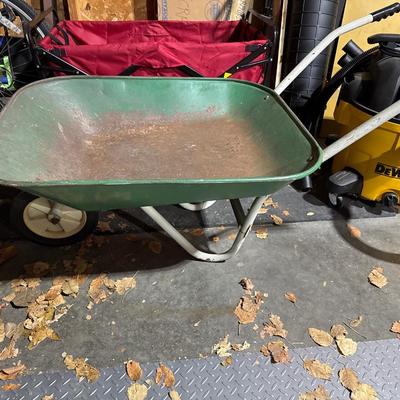 Vintage green wheel barrel