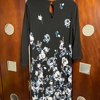 Sale Photo Thumbnail #59: Travel with this one, 2 dresses in one. Solid black reverses to a floral print. New size medium.