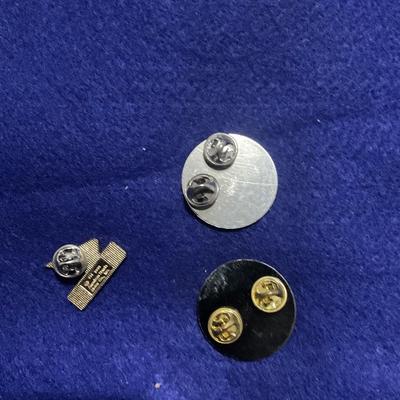 2004 and 2006 100,000 ft motorcycle ride and Honda pin.