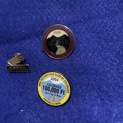 2004 and 2006 100,000 ft motorcycle ride and Honda pin.