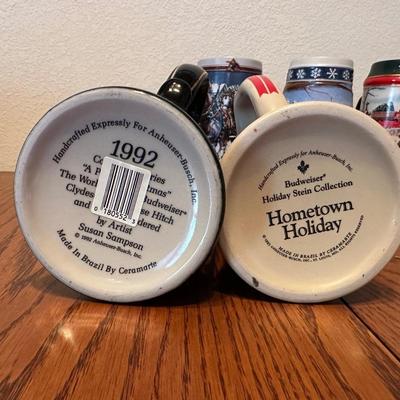 ARRAY OF BUDWEISER STEINS