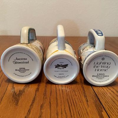 ARRAY OF BUDWEISER STEINS