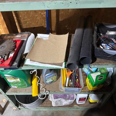 Green steel shelving unit with miscellaneous