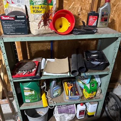 Green steel shelving unit with miscellaneous