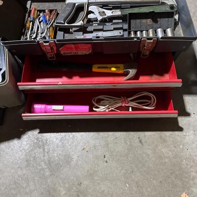 Three toolboxes with tools
