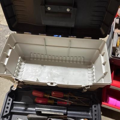 Three toolboxes with tools