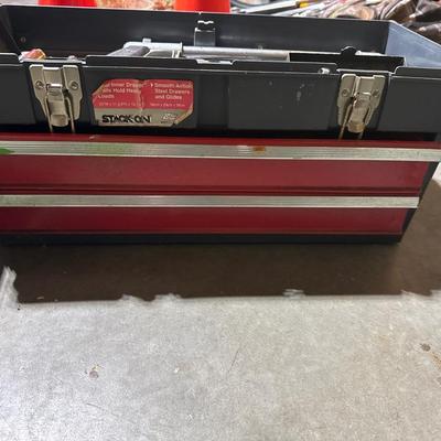 Three toolboxes with tools