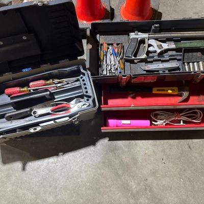 Three toolboxes with tools