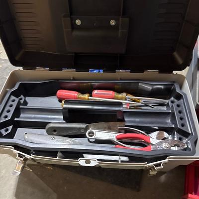 Three toolboxes with tools