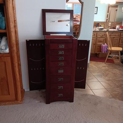 JEWELRY ARMOIRE W/8 DRAWERS, SIDE DOORS FOR NECKLACES AND LIFT UP TOP W/MIRROR