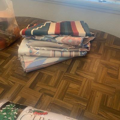 SEVERAL YARDS OF MATERIAL & CUT FOR QUILTING AND OTHER LARGE PIECES OF MATERIAL