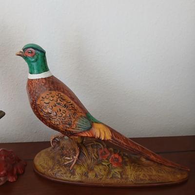 Hunting boy and Pheasent ceramic statues