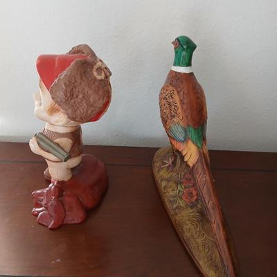 Hunting boy and Pheasent ceramic statues