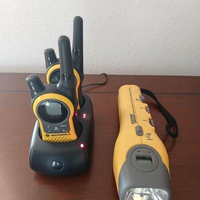 Motorola walkie talkies with charging station and an Electro Barand Multi use flashlight / radio