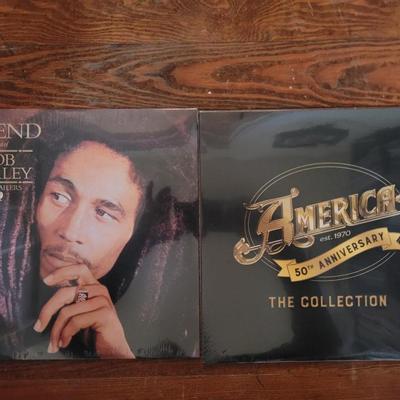2 Brand new and unopened albums