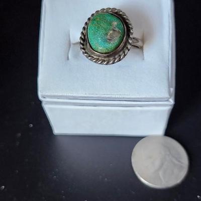 Turquoise ring in rope design setting