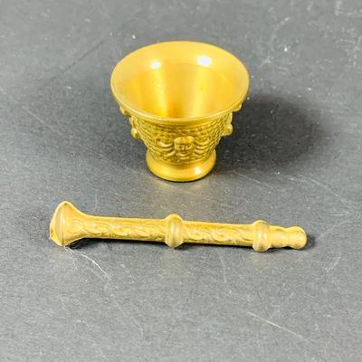 LOT:53: Medieval Coat of Arms, Don Quixote Metal Statue and Metal Ashtray, Miniature Alter Cross, Mini Brass Mortar and Pestle and a Thimble