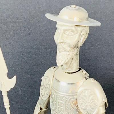 LOT:53: Medieval Coat of Arms, Don Quixote Metal Statue and Metal Ashtray, Miniature Alter Cross, Mini Brass Mortar and Pestle and a Thimble