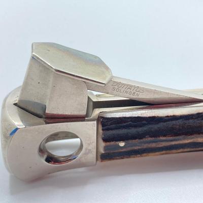 LOT 65: Vintage Solingen German Horn Handle Cigar Cutter, Eddie Bauer Classic Maple Yo-Yo / Shoe Horn, Sharp Folding Pocket Knife and More