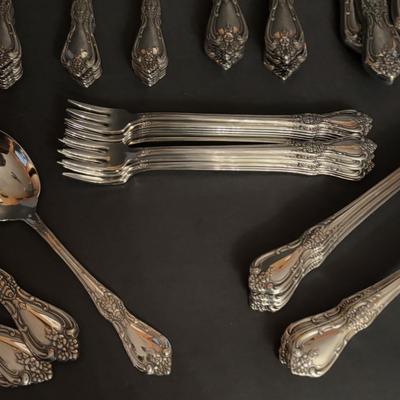 LOT 172: Distinction Deluxe Stainless by Oneida, 7 pc Place Setting, Service for 12 & 5 Serving Pieces