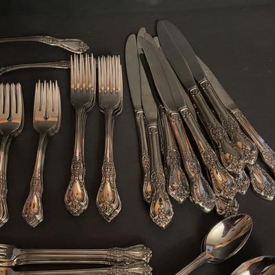 LOT 172: Distinction Deluxe Stainless by Oneida, 7 pc Place Setting, Service for 12 & 5 Serving Pieces