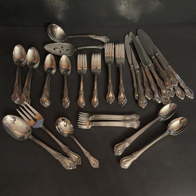 LOT 172: Distinction Deluxe Stainless by Oneida, 7 pc Place Setting, Service for 12 & 5 Serving Pieces