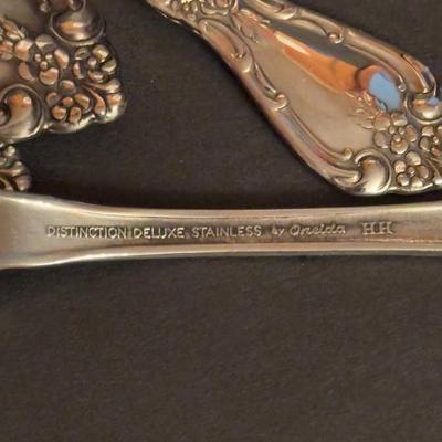 LOT 172: Distinction Deluxe Stainless by Oneida, 7 pc Place Setting, Service for 12 & 5 Serving Pieces