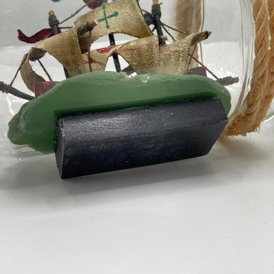 LOT 177: Explorer’s Collection - Santa Maria Ship Radio, Cork Art, Ship in Glass Bottle, Brass Whale, Decorative Desk Globe and More