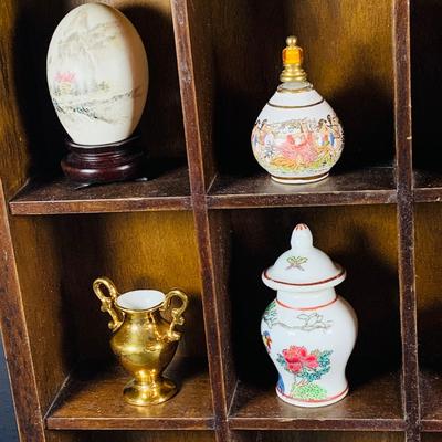 LOT:191: Wooden Display Case w/Asian Inspired Miniature Vases & Bottles and Painted Egg Shells and More