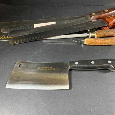 LOT:202: Assortment of Knives, Cleaver, and Carving Tools Featuring Connoisseur Slicer Knives, Remington Cleaver and More