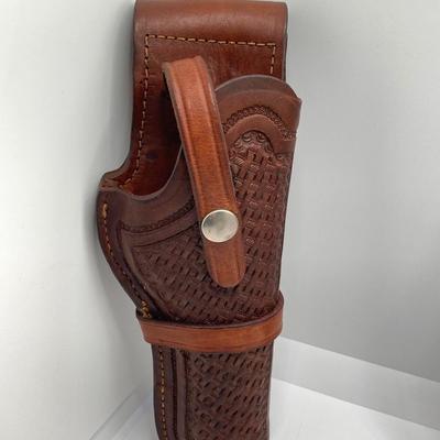 LOT 249: Three Leather Firearm Holders / Holsters, Doskocil Gun Case and Cleaning / Care Supplies (Outers Case) and More