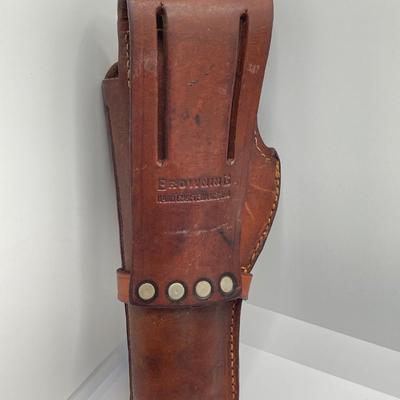 LOT 249: Three Leather Firearm Holders / Holsters, Doskocil Gun Case and Cleaning / Care Supplies (Outers Case) and More