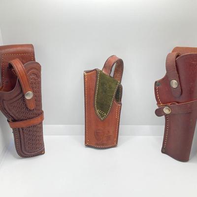 LOT 249: Three Leather Firearm Holders / Holsters, Doskocil Gun Case and Cleaning / Care Supplies (Outers Case) and More