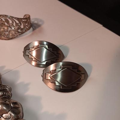 CHARM BRACELET AND AN ASSORTMENT OF SILVER-TONE JEWELRY