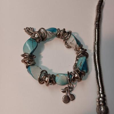 CHARM BRACELET AND AN ASSORTMENT OF SILVER-TONE JEWELRY