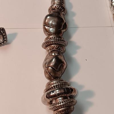 CHARM BRACELET AND AN ASSORTMENT OF SILVER-TONE JEWELRY