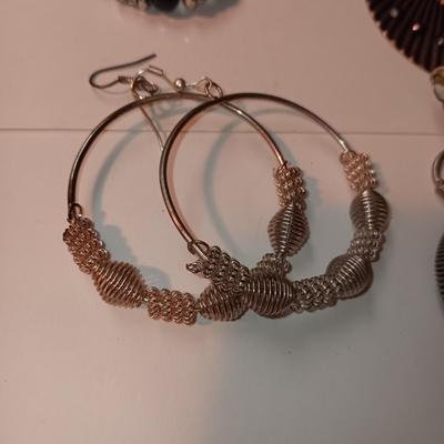 CHARM BRACELET AND AN ASSORTMENT OF SILVER-TONE JEWELRY