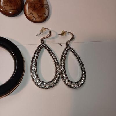 CHARM BRACELET AND AN ASSORTMENT OF SILVER-TONE JEWELRY