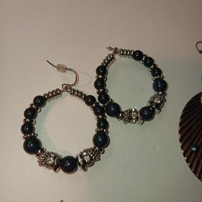 CHARM BRACELET AND AN ASSORTMENT OF SILVER-TONE JEWELRY