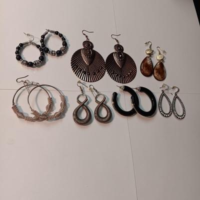 CHARM BRACELET AND AN ASSORTMENT OF SILVER-TONE JEWELRY
