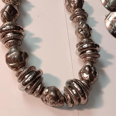 CHARM BRACELET AND AN ASSORTMENT OF SILVER-TONE JEWELRY