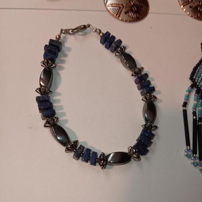 EARRINGS, BRACELETS AND A WATCH