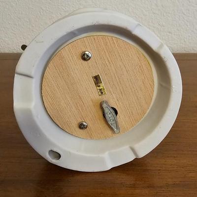 Collectible Avon plate " Dashing through the snow" with musical swan and a clay Guardian Angel