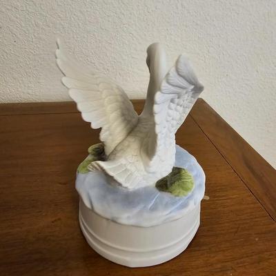 Collectible Avon plate " Dashing through the snow" with musical swan and a clay Guardian Angel
