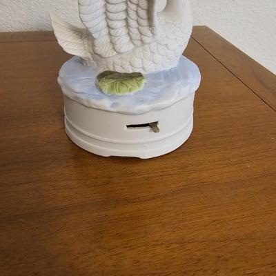 Collectible Avon plate " Dashing through the snow" with musical swan and a clay Guardian Angel