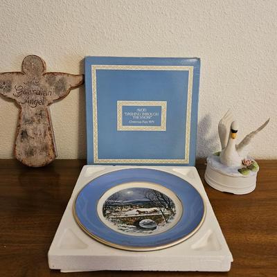 Collectible Avon plate " Dashing through the snow" with musical swan and a clay Guardian Angel