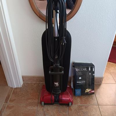 LIKE NEW RICCAR VACUUM WITH A BOX OF BAGS
