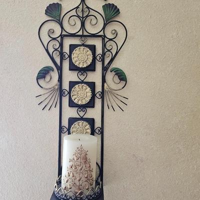 Decorative metal pillar candle holder with candle